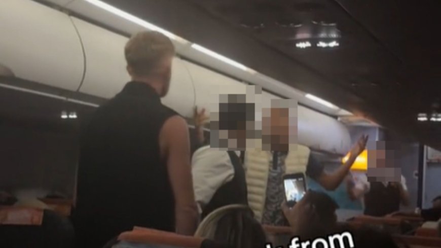 Moment ‘drunk’ easyJet passengers square off for midair brawl in aisle as captain pleads ‘you’re making things worse’ --[Reported by Umva mag]