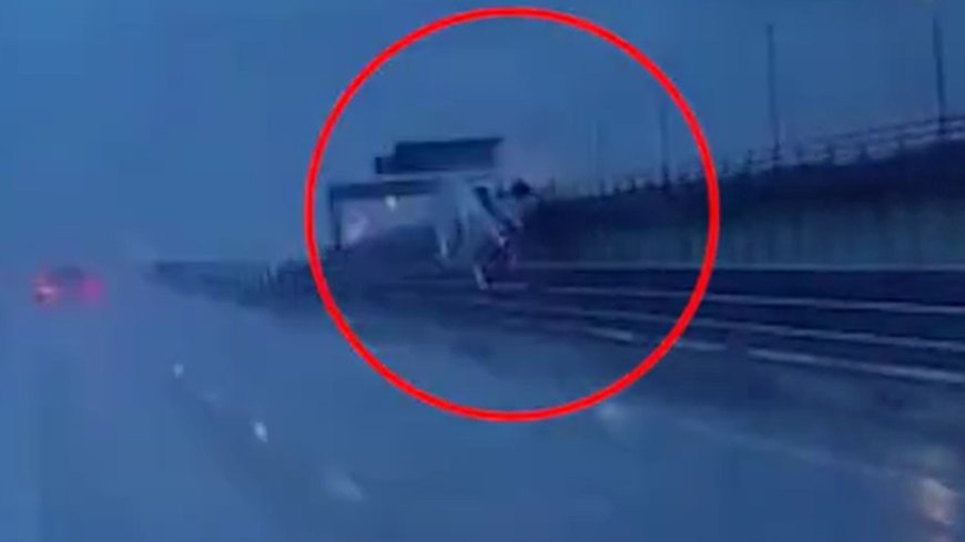 Dramatic moment lorry crashes through safety barrier and plunges 60ft from M6 bridge on to embankment below --[Reported by Umva mag]