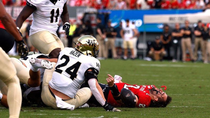 NC State quarterback Grayson McCall carted off the field after scary hit sends helmet flying --[Reported by Umva mag]