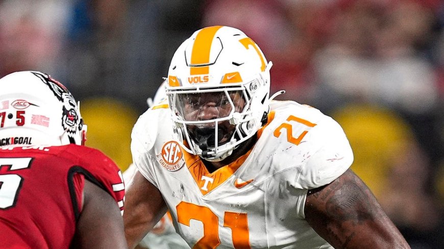 Tennessee player shoves fan storming field to the ground after upset loss to Arkansas --[Reported by Umva mag]