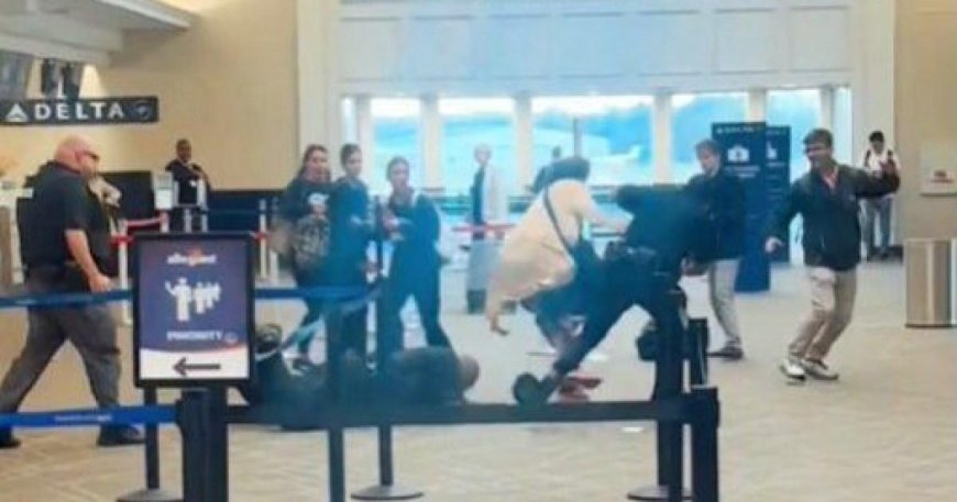 Moment airline customer jumps behind check-in counter and threatens to ‘kill’ cops --[Reported by Umva mag]