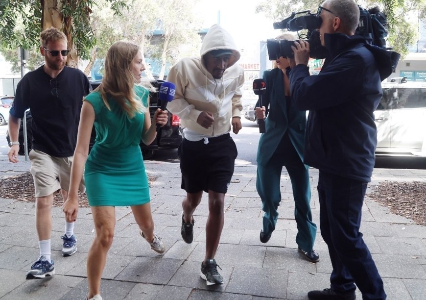 Watch moment UK rapper Yung Filly dodges TV reporter as he visits Australian police station on bail after rape charge --[Reported by Umva mag]